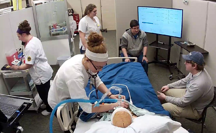 Nursing students work with theatre students in the Healthcare Simulation Practicum.