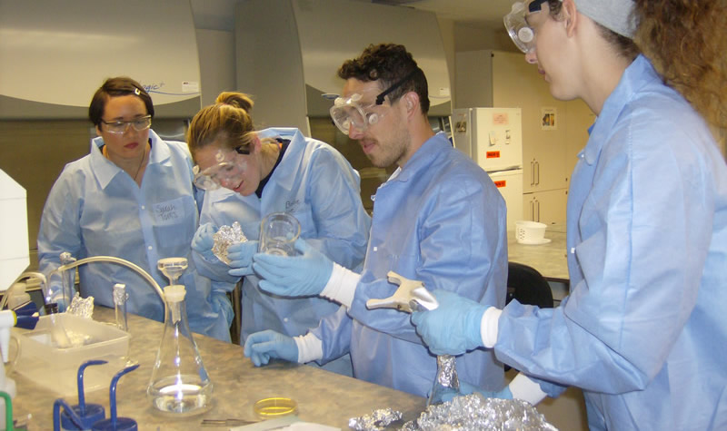 Medical Laboratory Science students practicing techniques for counting bacteria