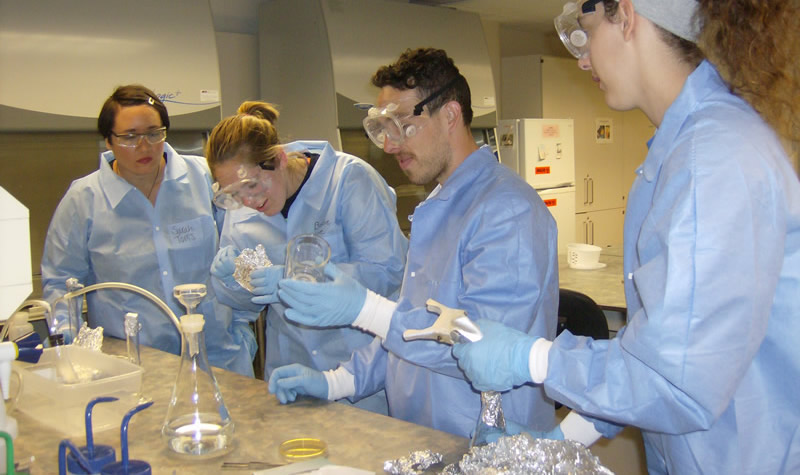 Medical Laboratory Science students practicing techniques for counting bacteria Medical Laboratory Science students practicing techniques for counting bacteria