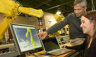 The Robotics and Automation Laboratory Student and Professor with Robot
