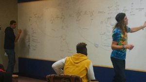 Whiteboard Wall 1 LSSU Learning Commons: Students working at the Whiteboard Wall.