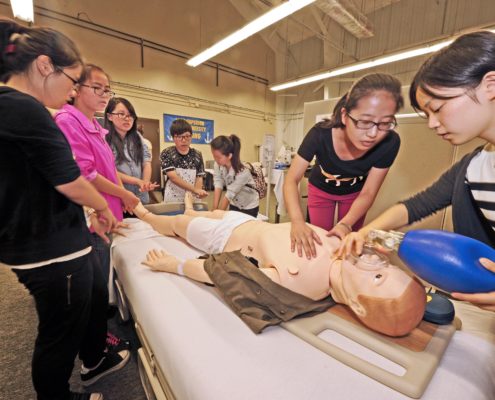 Visiting Students experience the drama of the nursing SIM lab