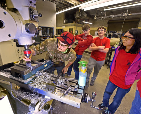 Visiting High School Students find out what goes on in the machining lab
