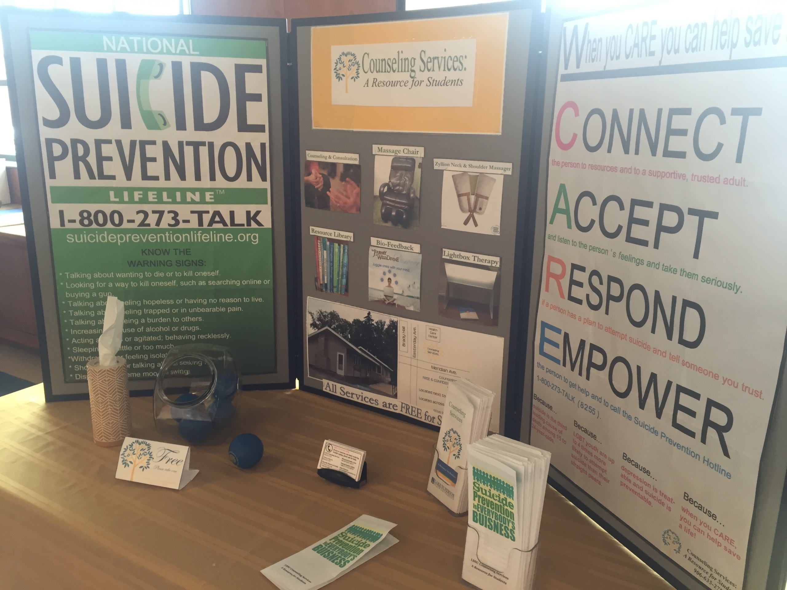 Information about suicide prevention is on display, including the Suicide Prevention Lifeline number 1-800-273-8255