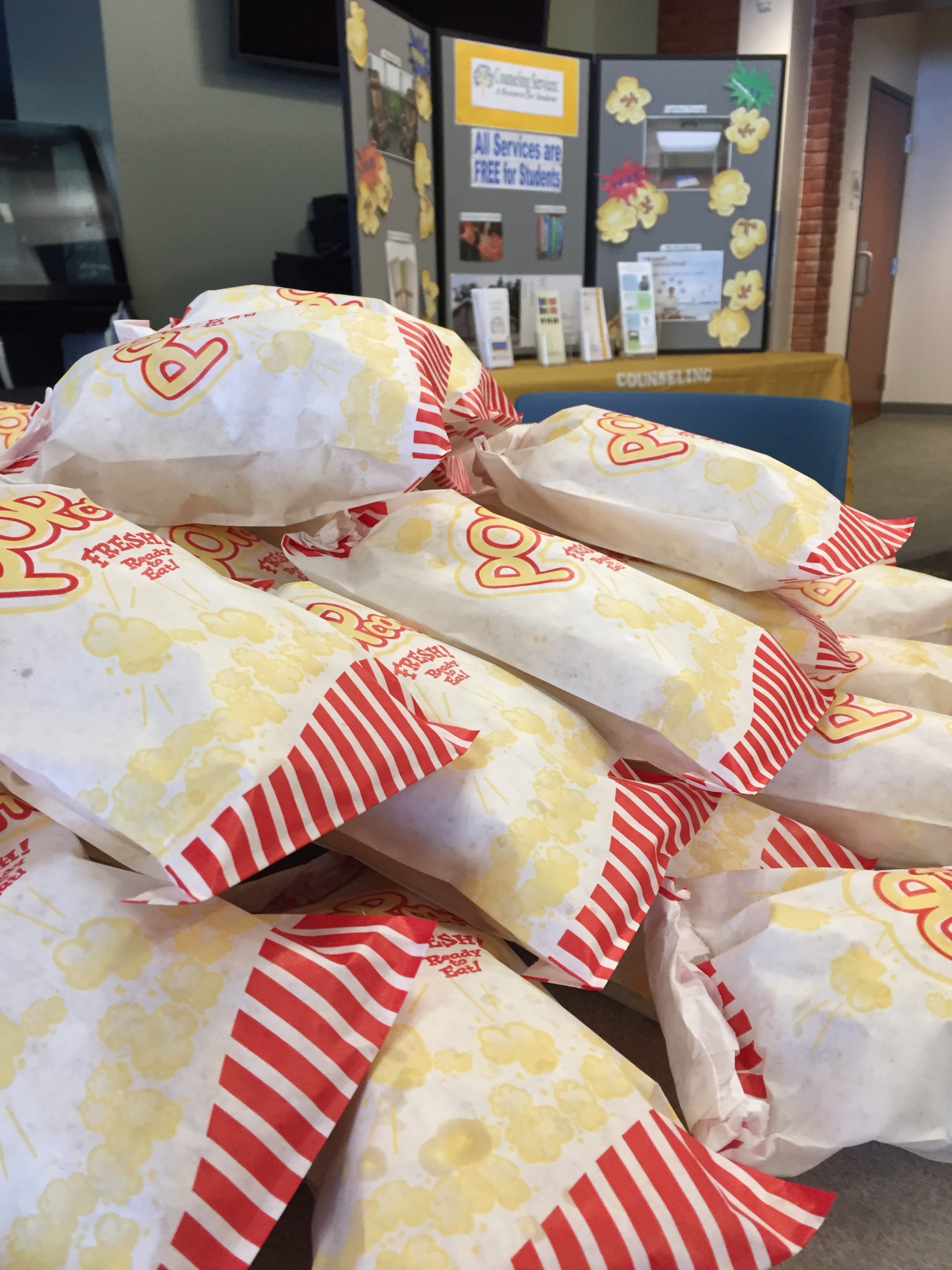 Bags of warm popcorn are passed out to encourage students to "pop in" to Counseling Services for support, when needed