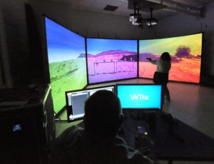 Our new VirTra Simulation system shows a young student practicing shooting targets on three virtual screens