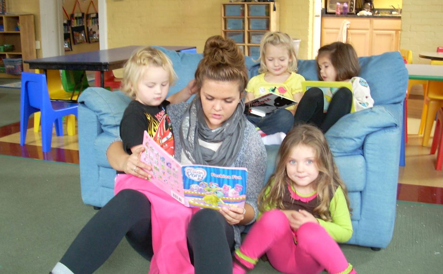 Lake State elementary education student reading to preschool students