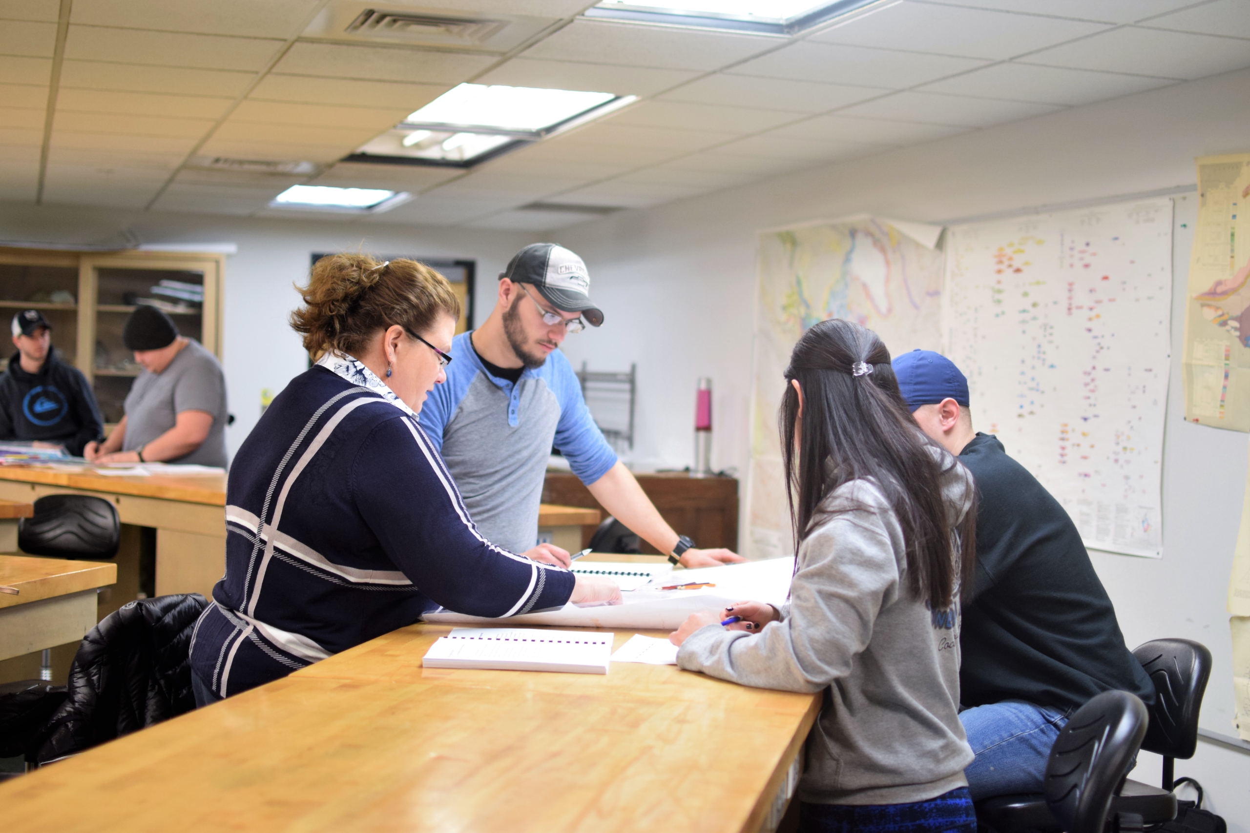 Crawford 339 with students working with maps