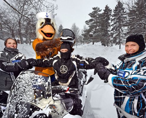 Pres. Mitchell readies on snowmobile