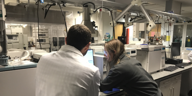 Faculty and student working in chemistry lab