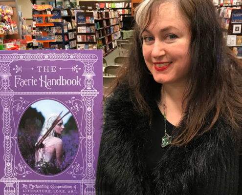 Author Carolyn Turgeon poses by The Faerie Handbook