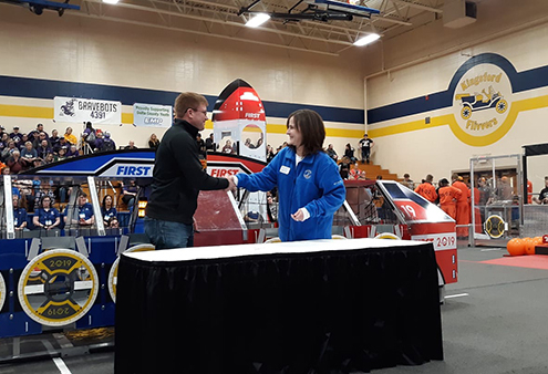 Bay College’s Vice President of Academic Affairs, Matt Barron, and Dean of the College of Innovation and Solutions at LSSU, Kimberly Muller shake hands