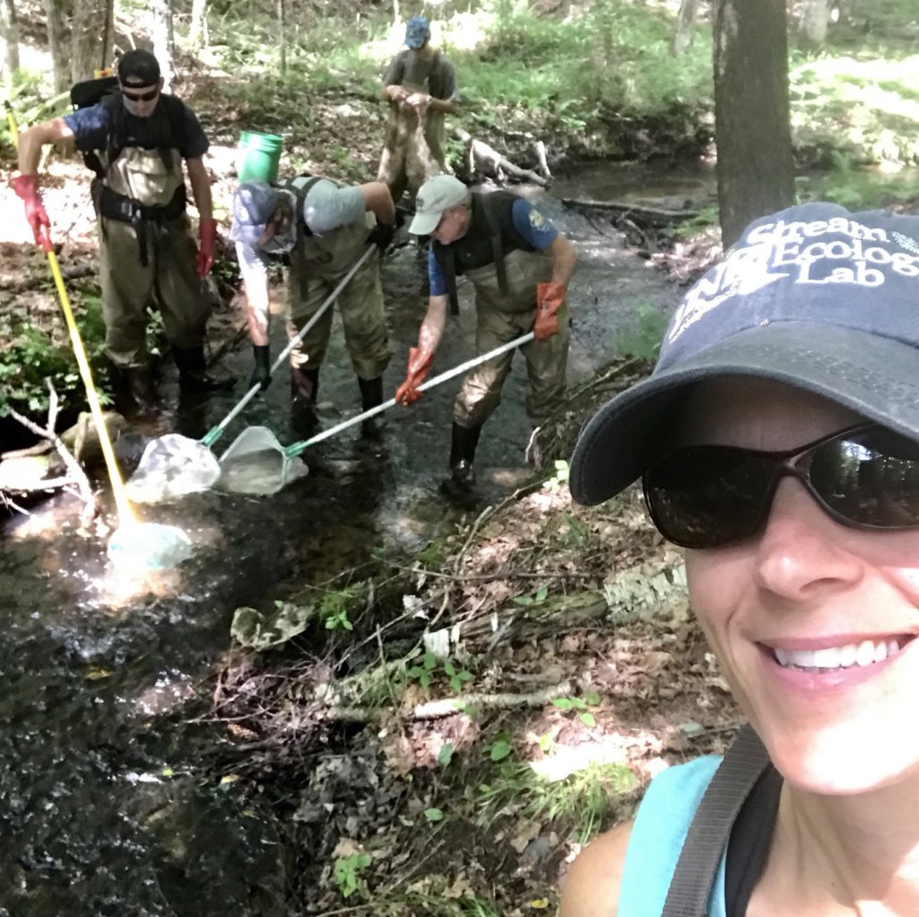 students in outdoor class on a river