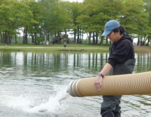 Gary releasing fish into the river