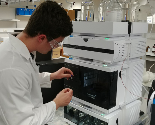 Chemistry student, Justin Blalock, calibrates an Agilent 1290 Ultra-High Pressure Liquid Chromatograph