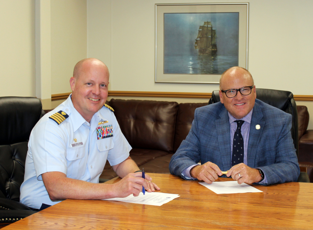 Captain Nelson and President Hanley sign the 10th annual Coast Guard Tuition Agreement