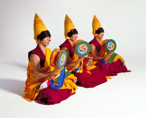 Monks with traditional instruments and regalia.