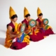 Monks with traditional instruments and regalia.