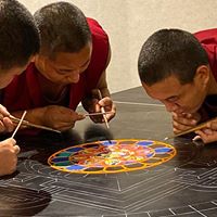 Monks working on the sand painting
