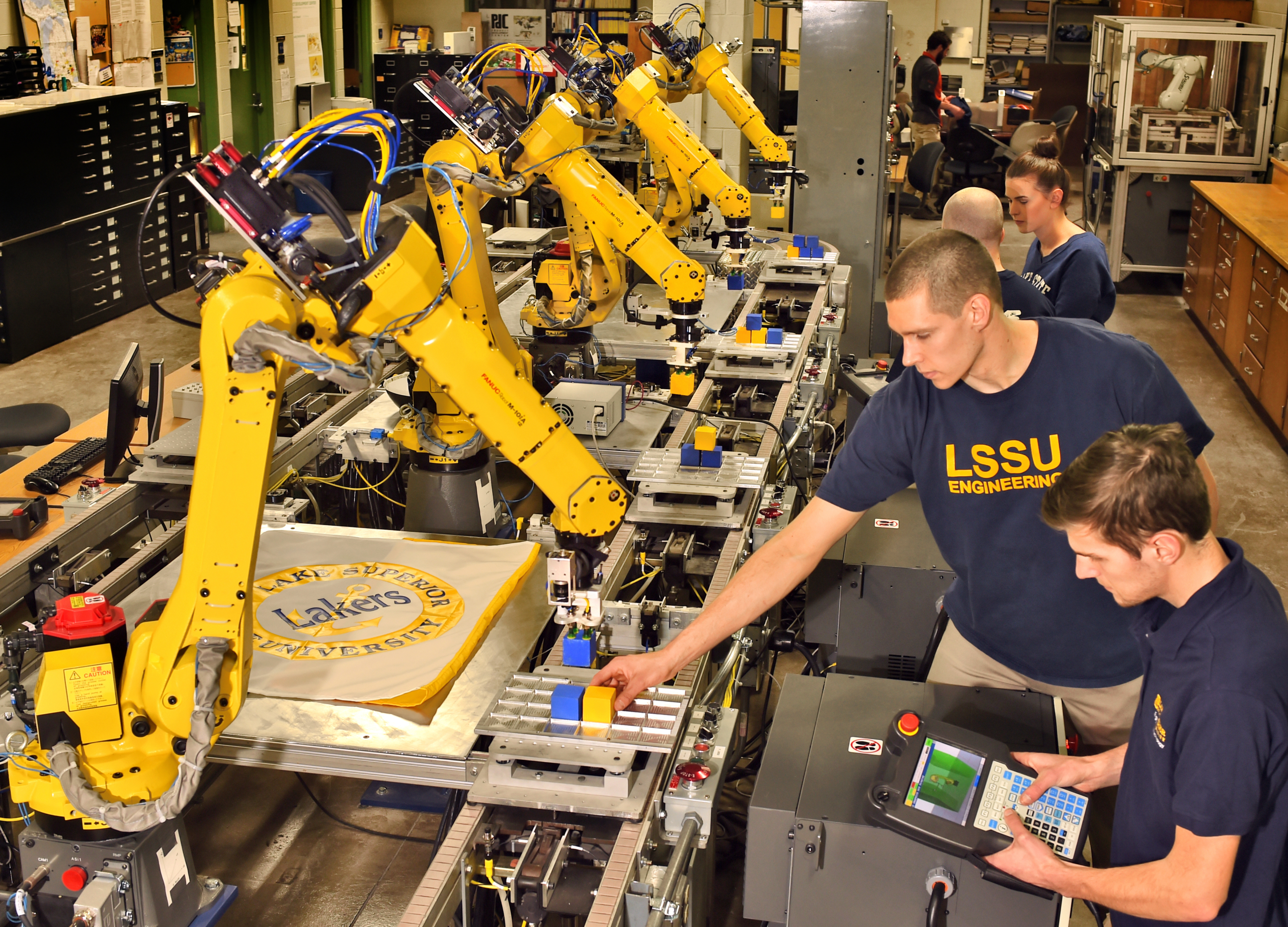 student with robot arm