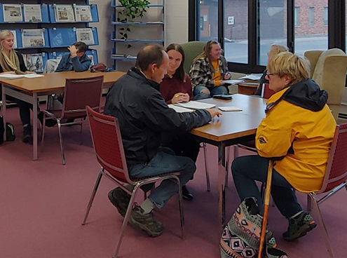 Students at the library work on a project