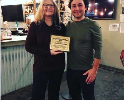 Les Cheneaux Culinary Arts Regional Center officials Zach Schroeder, director and instructor, and June Patton, restaurant administrator, accept the 2020 Institution of the Year commendation from the Les Cheneaux Chamber of Commerce on Nov. 11, 2020.