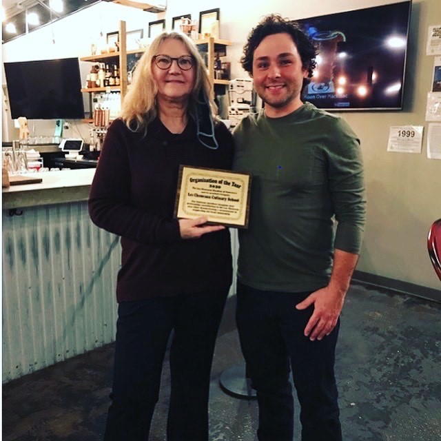 Les Cheneaux Culinary Arts Regional Center officials Zach Schroeder, director and instructor, and June Patton, restaurant administrator, accept the 2020 Institution of the Year commendation from the Les Cheneaux Chamber of Commerce on Nov. 11, 2020.