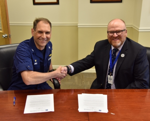 Coast Guard and LSSU leaders sign the tuition agreement