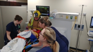 Interprofessional healthcare students perform a simulation event