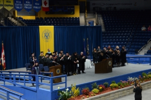 Professor of Psychology Dr. Kristina Olson-Pupek walks up the ramp to receive her award.