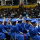 Graduates move their tassels at commencement.