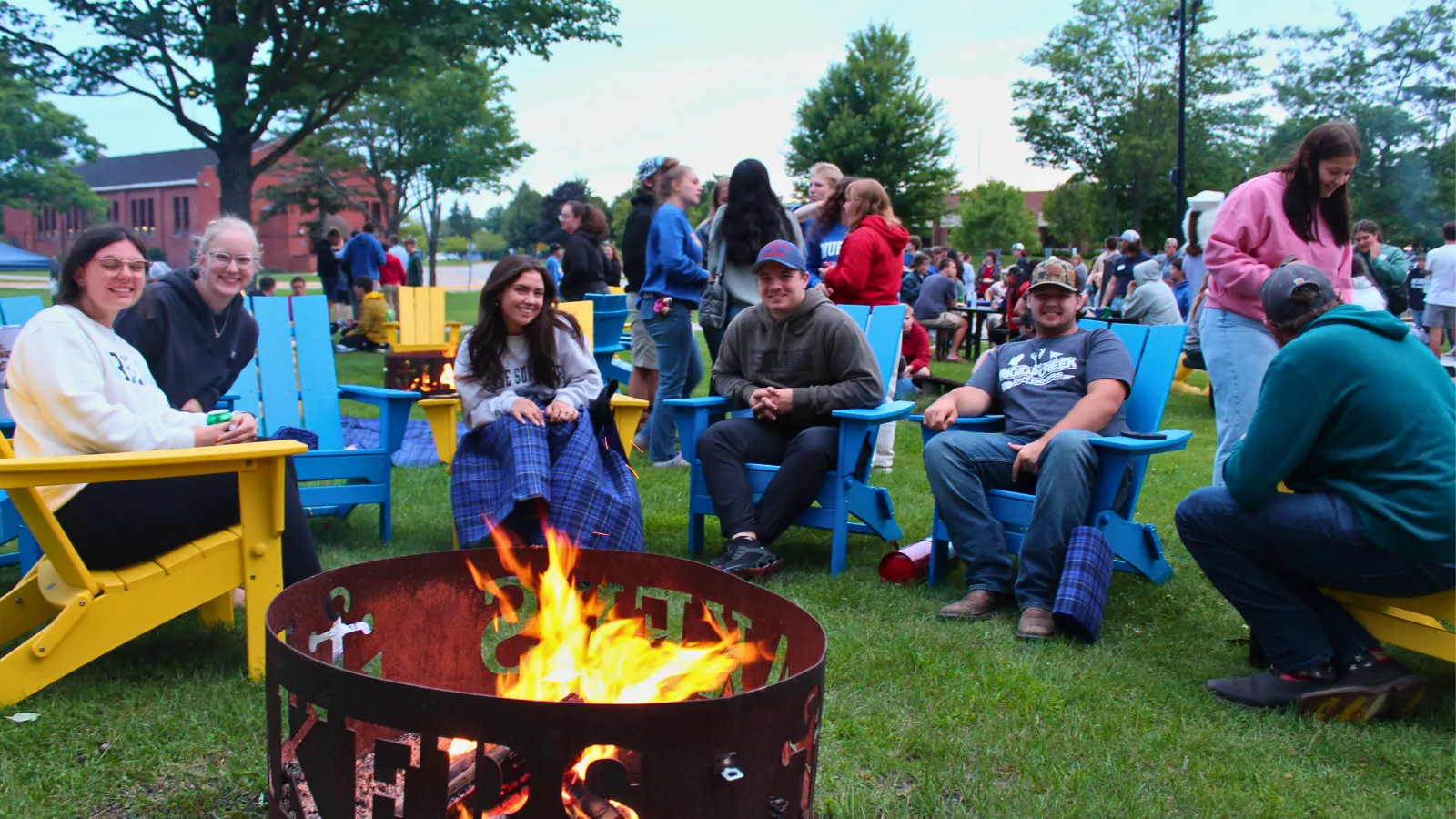 Students sitting around the fire