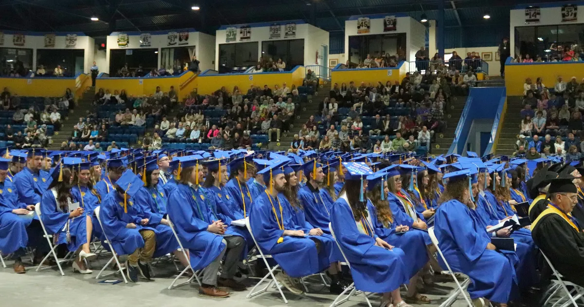 Photo of LSSU graduates and spectators seated during the commencement ceremony, showcasing the event.