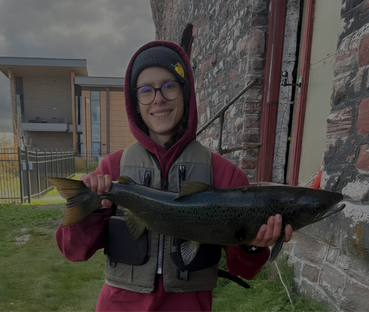 Student Holding Up a King Salmon
