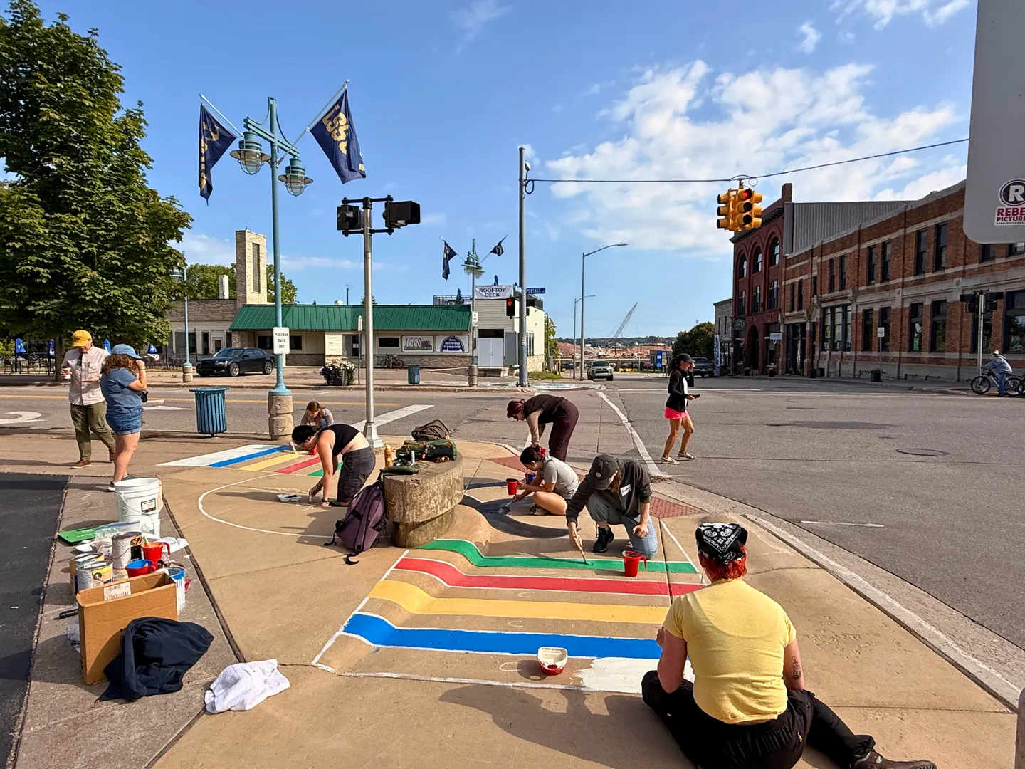 LSSU CoGLEE students decorating downtown sidewalks with chalk.