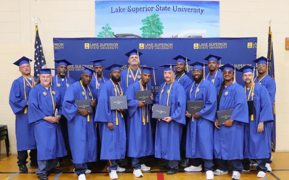 Photo of STEP-UP program graduates dressed in caps and gown.