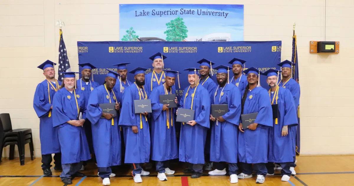 Photo of STEP-UP program graduates dressed in caps and gown.