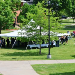 Arial photo of the lunch line going into the canopy and exiting the canopy to tables for seating.