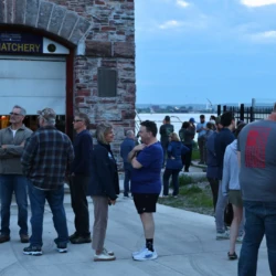 Community conversing outside the Fish Hatchery, awaiting further darkness to start LSSU's release.