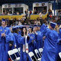 Graduates celebrating following the formation commencement proclamation.