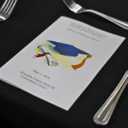 LSB Banquet brochure on table surrounded by silverware.