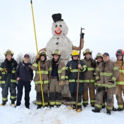 Group of Fire Science students gathered in front of the snowman before the burning event.