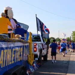 LSSU Float with Mascot and President during parade