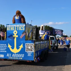 LSSU Float with Mascot and President during parade