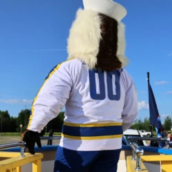 LSSU Float with on board facing the back of the mascot