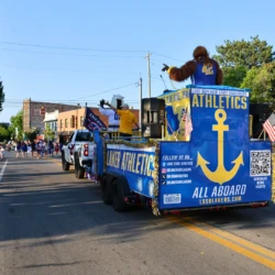 LSSU Float with Mascot and President during parade