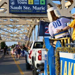 LSSU Float with Mascot and President during parade