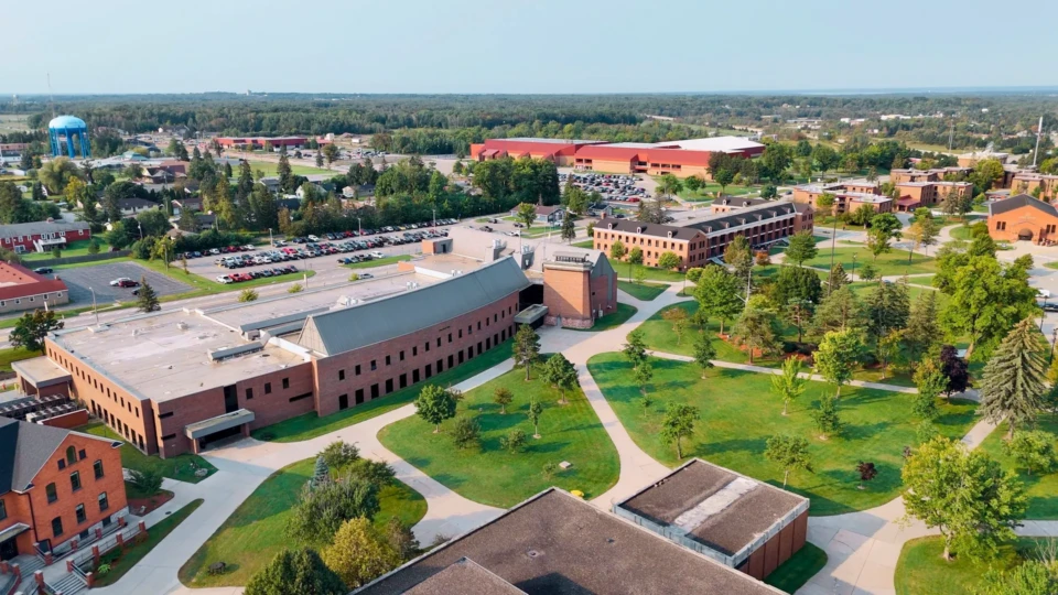 Drone image of LSSU faced towards Sault Ste. Marie, with a water tower visible in the background.